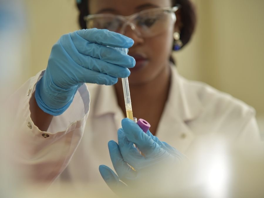Lab scientist pipetting a blood sample